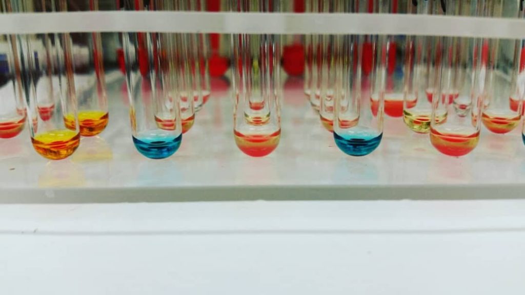 Close up of vials holding colored liquids