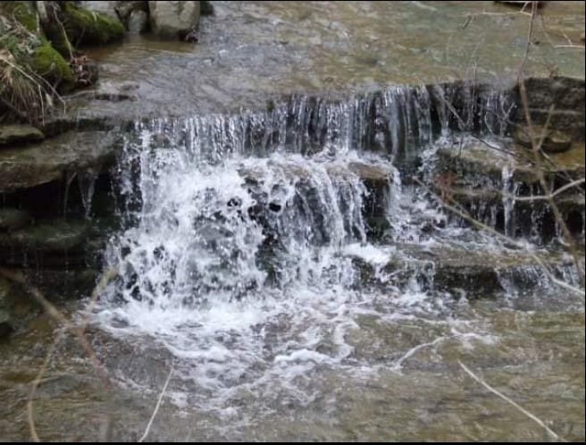 Photo of a small waterfall in a brook