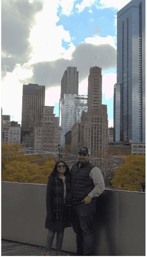 Two people posing before the Chicago skyline